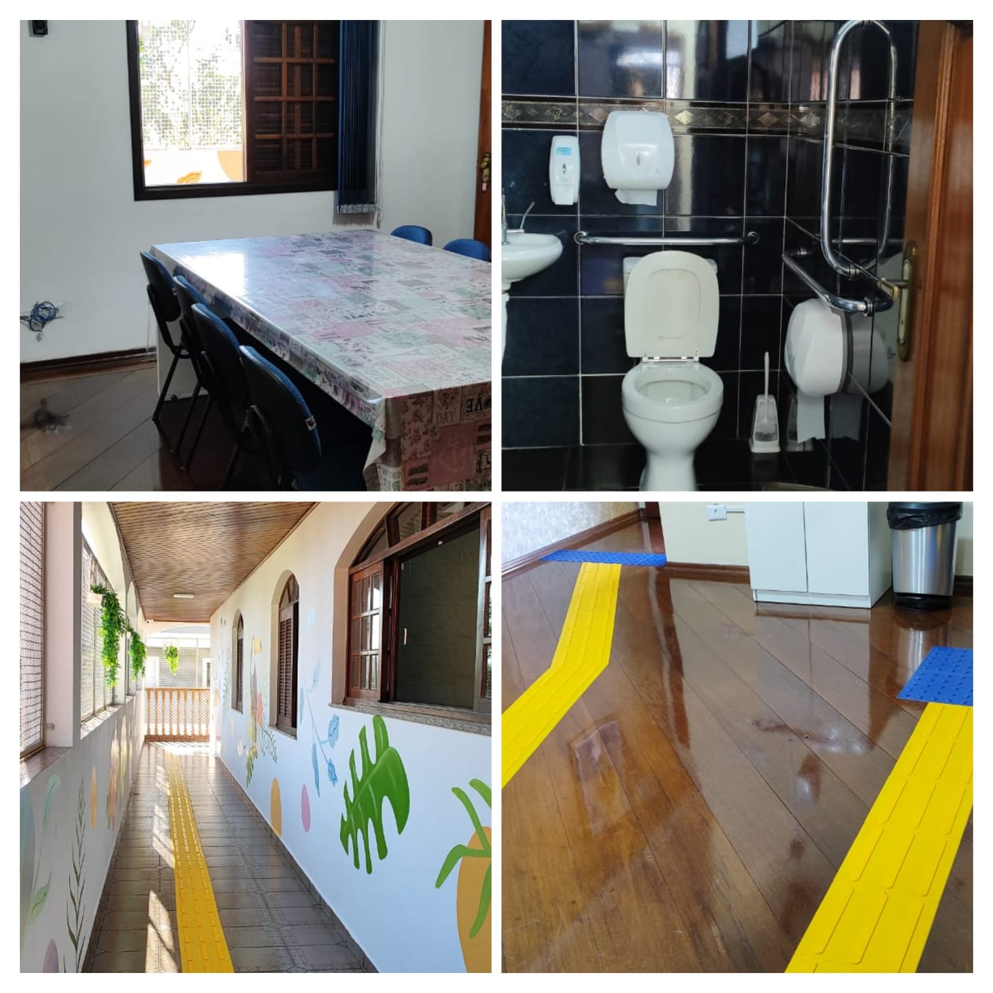 A imagem se trata de um layout com quatro fotografias. Na foto do canto superior esquerdo aparece uma mesa com cadeiras azuis de frente para uma janela aberta. A foto do canto superior direito mostra um banheiro com porcelanato preto com um vaso sanitário centralizado e diversos corrimãos de acessibilidade. Na foto do canto inferior esquerdo aparece um corredor com janelas abertas na lateral e pinturas de folhas e flores nas paredes. A foto do canto inferior direito mostra  o chão de madeira do espaço com pisos táteis coloridos em azul e amarelo.